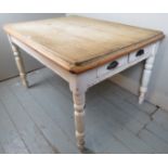 A 19th Century pine farmhouse kitchen table with planked top over painted turned legs est: £80-£120