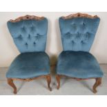 A pair of 20th Century continental walnut chairs upholstered in blue velvet est: £50-£80