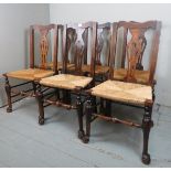 A set of six early 20th Century country dining chairs with rush seats and six loose cushions est: