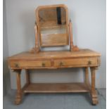 A fine Arts and Crafts light wood dressing table with a central swivel mirror over two drawers est: