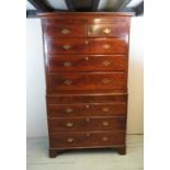 A 19th Century flame mahogany chest on chest with brass handles and ivory lock escutcheons,