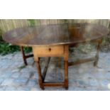 An impressive large late 17th / early 18th Century oak gate leg oval drop leaf table of good rich