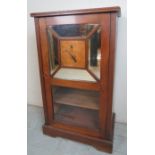 An early 20th Century small pier cabinet with a part mirrored door and inset marquetry panel est: