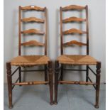 A pair of early 20th Century ladder back rush seated country chairs est: £25-£45