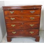 An good quality 19th Century mahogany bachelors chest of four long graduated drawers beneath a
