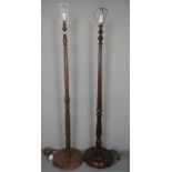 Two reeded column standard lamps terminating on circular bases est: £30-£50