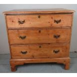 A 19th Century pine chest of three long drawers with brass handles and escutcheons est: £80-£120