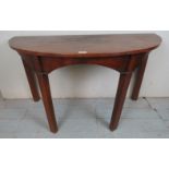 A 19th century mahogany demi-lune table,