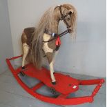 An early 20th Century rocking horse on a