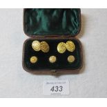 A pair of probably gold cuff links and t