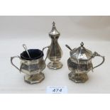 A three piece silver condiment set with