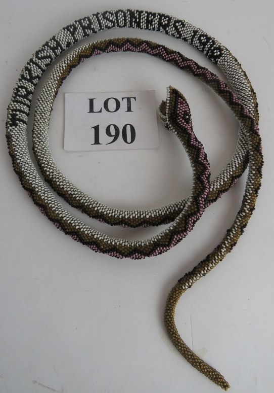 Prisoner of War - A bead-work snake insc