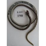 Prisoner of War - A bead-work snake insc