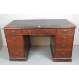 A 19c oak pedestal desk with a black lea