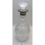 A heavy cut glass decanter and stopper w