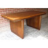 An Art Deco pale oak dining table in cle