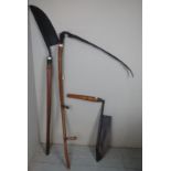 A large old two handed scythe together w