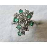 An 18ct white gold diamond and emerald r