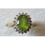 An 18ct gold peridot and diamond ring, s