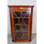 A 19th Century glazed mahogany wall hang