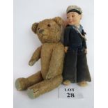 An early 20th century straw-filled Teddy bear, 48 cm high,