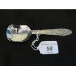 A Keswick School of Industrial Arts ;Staybrite' caddy spoon, decorated with planished handle,