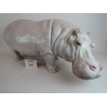 A large well modelled glazed ceramic hippo, 90 cm long,