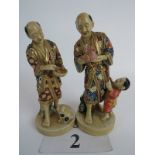 A pair of Japanese Satsuma pottery figures, signed,