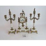 A French mantle clock on twin marble pil