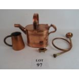 A copper watering can, 25 cm tall, a hun