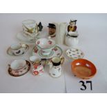 A collection of miniature porcelain to i