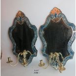 A pair of highly decorative wall mirrors with candle sconces,