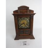 Wooden cased late Victorian mantle clock, key & pendulum,