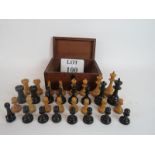 A vintage wooden chess set in a box,