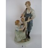 A large Royal Dux ceramic figure group, sentimental scene of parents and infant, 64 cm high,