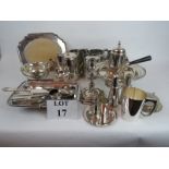 A quantity of silver plated items, including a chocolate pot, bread board, candlestick, cake basket,