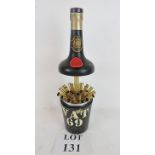 Early 20th century novelty cigarette dispenser in the form of a VAT 69 bottle,