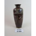 A Chinese vase with floral decoration and alternating panels of dragons and phoenix est: £30-£50