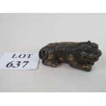 A Chinese cast metal figure of a dog of foe,