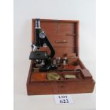 Scientific microscope in fitted wooden case with some accessories, 3 levels of magnification,