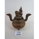 A Chinese replica incense burner with twin handles and a dog of foe surmounting to lid,