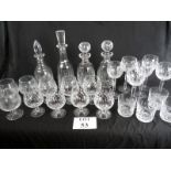 A suite of Waterford crystal to include tall wine glasses, brandy glasses, four decanters,