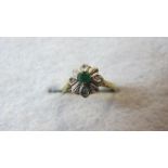 An 18ct gold emerald and diamond ring,