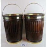 An impressive pair of mahogany peat buckets with carved fluted design, brass liners,