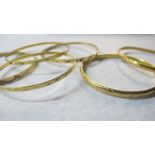 Four 18ct gold bangles,