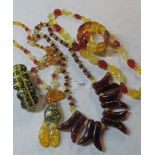 Two Polish amber necklaces and three bracelets est: £30-£50