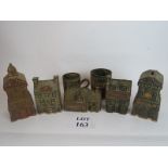 Five stoneware money boxes in the form of banks and pubs,