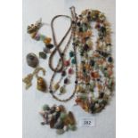 A collection of semi-precious stone necklaces,