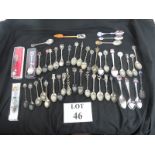 A collection of souvenirs commemorative teaspoons, many silver plate, some with enamel decoration,