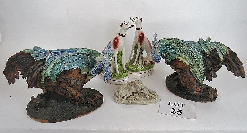 A pair of contemporary ceramic models of cockerels, a pair of modern Staffordshire pottery dogs,